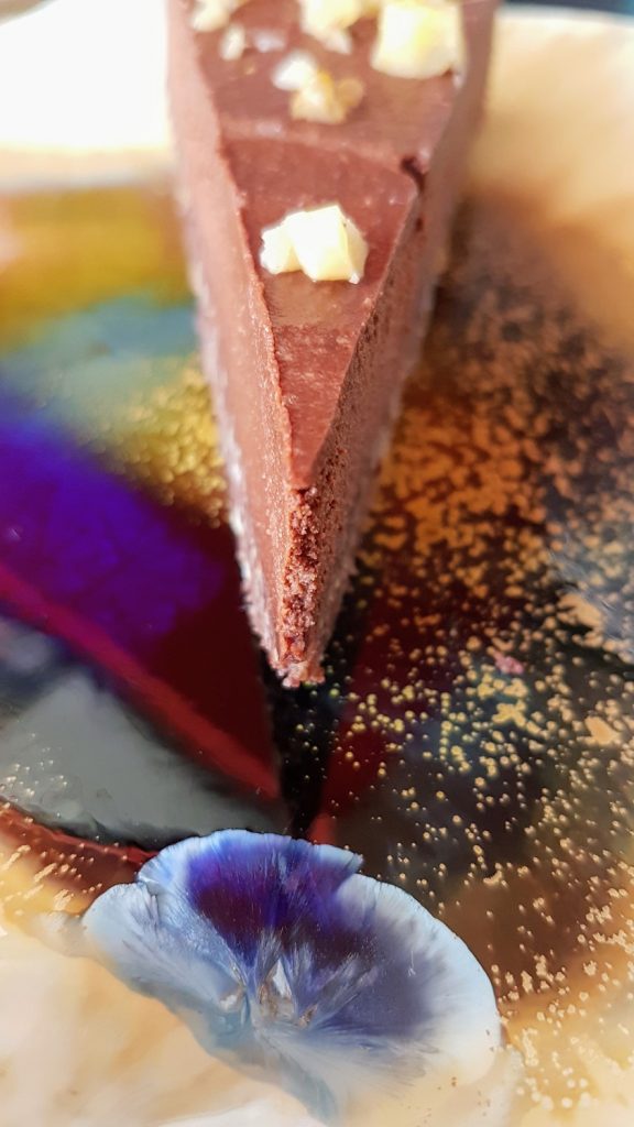 Hazelnut & Choco Cake Slice on Colourful Ceramic Plate